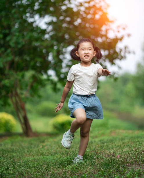 istock Cute little Girl Running 1254391547
