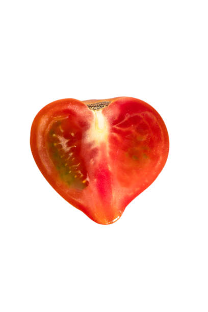 istock cut red fresh half tomato isolated on white background 1254392573