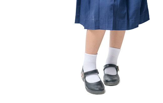 Asian Thai girls schoolgirl student wear a black leather shoes as a school uniform in isolated background, back to school concept