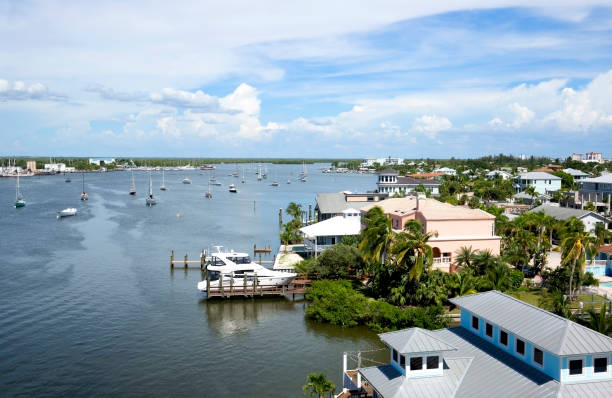 Fort Myers Beach Harbor Aerial view of homes and boats in Matanzas Harbor on Fort Myers Beach, Florida, USA. fort meyers beach stock pictures, royalty-free photos & images