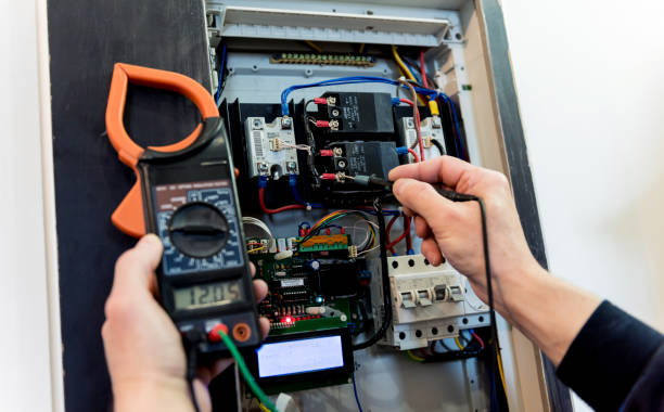 istock The man is repairing the switchboard voltage with automatic switches. 1254396941