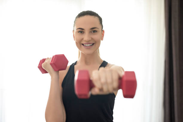istock Young woman working out 1254397437