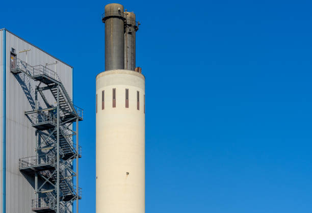 istock Low Angle View Of Factory Against Blue Sky 1254400249
