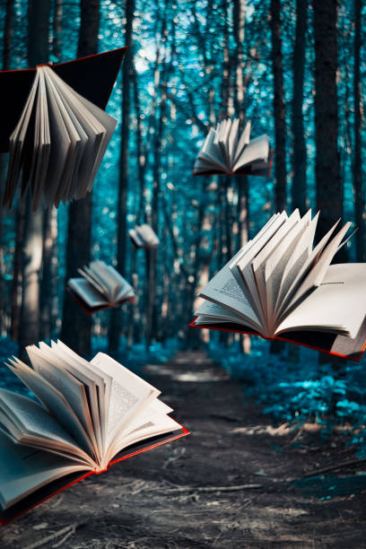 istock Red-bound books fly in the woods 1254404850
