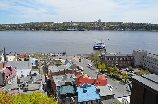 view from top of hill in Quebec, Canada with river and buildings