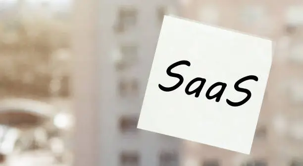 white paper with text Â SaaS on the window