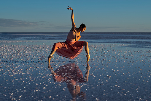 Ballerinas dancing at sunset on the lake - Salt lake in Turkey