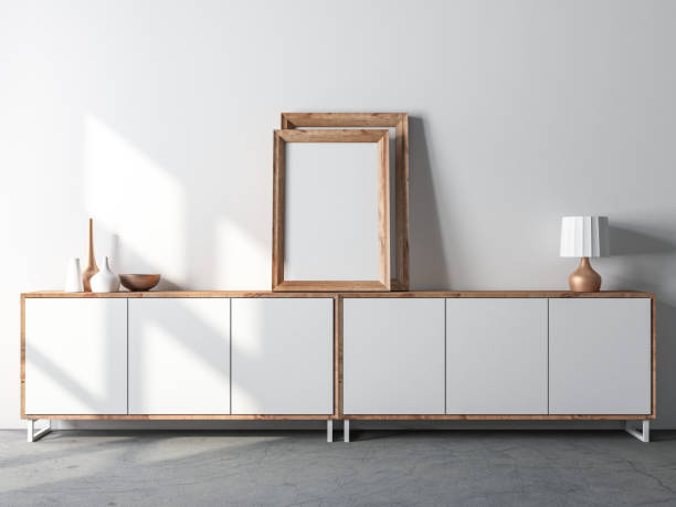 istock Wooden Frame Mockup standing on  Modern bureau near white wall, interior 1254414162