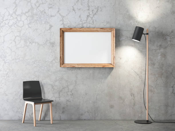 istock Wooden Frame Mockup hanging on concrete wall in room 1254414167
