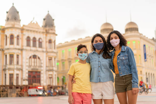 People with N95 respiratory mask in Marco Zero, Recife