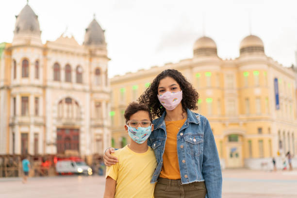 istock Tourists with N95 respiratory mask in Marco Zero, Recife 1254414517