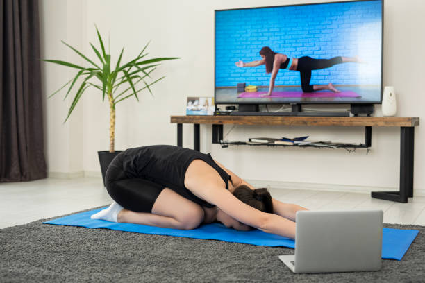 istock Woman perform yoga at home 1254414639