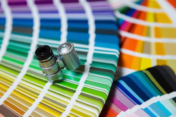 istock Swatch color cards with magnifying glass close-up 1254414810