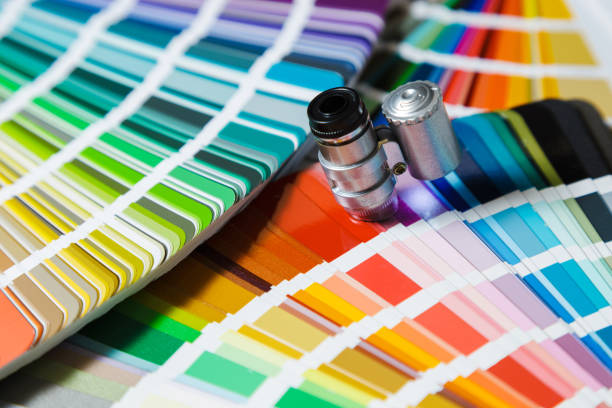 istock Colors catalogue with magnifying glass close-up 1254414875