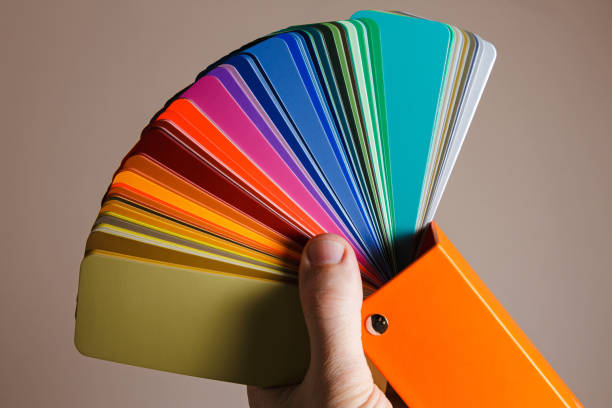 istock Hand holding a color palette for repair 1254414912