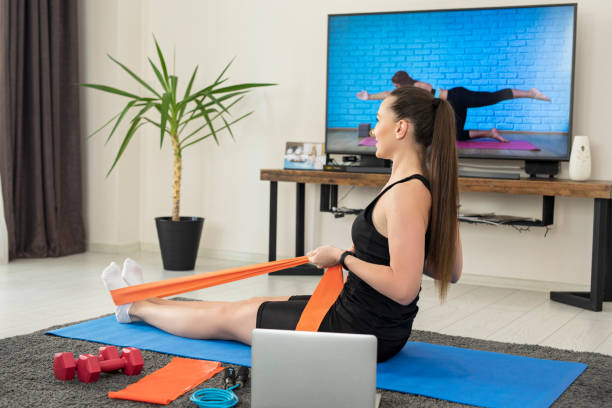 istock Home workout with resistance band at home 1254418050