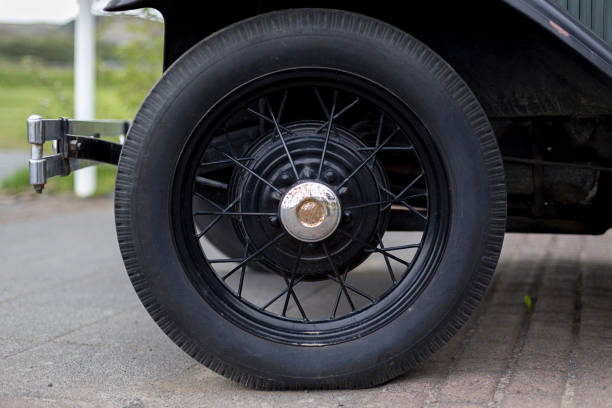 istock Wheel of a classic car 1254418101