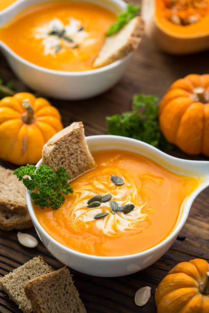 istock Pumpkin soup with parsley and cream 1254419167