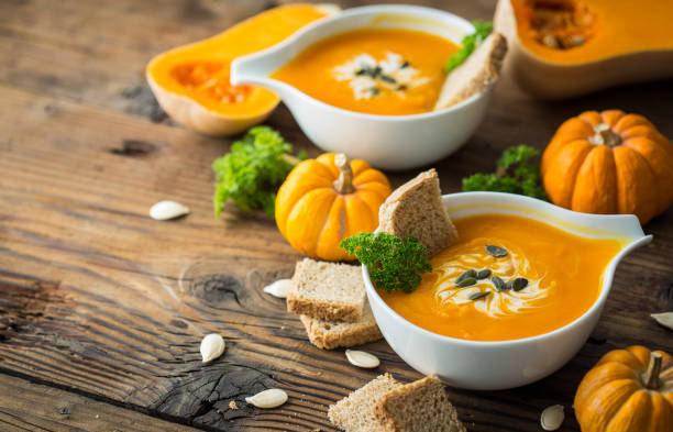 istock Pumpkin soup with parsley and cream 1254419183