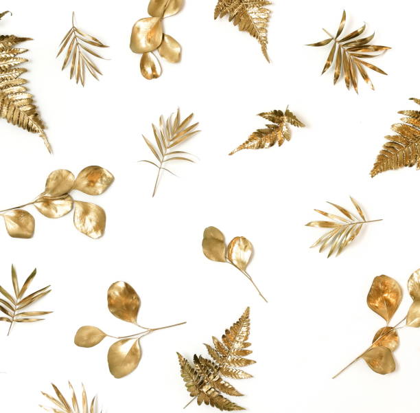 istock Gold leaves pattern isolated on a white background. top view.copy space.abstract. 1254420689
