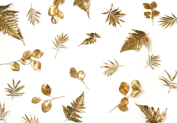 istock Gold leaves pattern isolated on a white background. top view.copy space.abstract. 1254420943