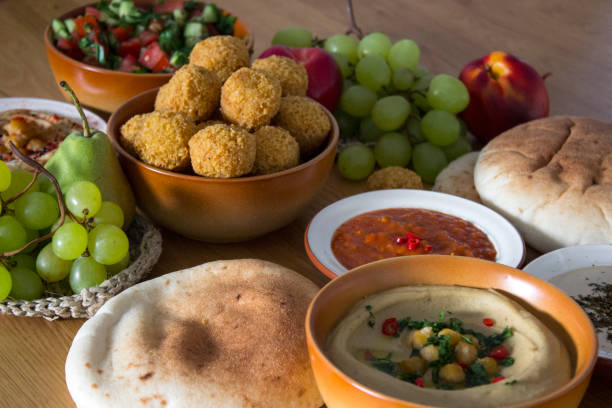 istock Hummus and pita bread on kitchen table 1254421717