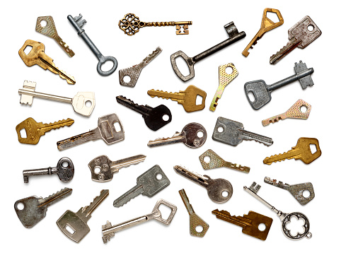 Old keys of different shapes isolated on white background. Flat lay, top view