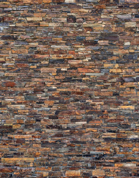 istock wall of dark brown, natural slate stone 1254421989