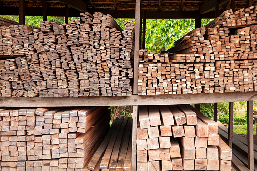 Stack of chopped wood logs outdoor, prepared for heating season