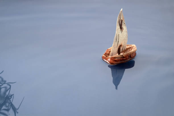 istock A boat made from a nut shell and birch bark floating on water 1254427347