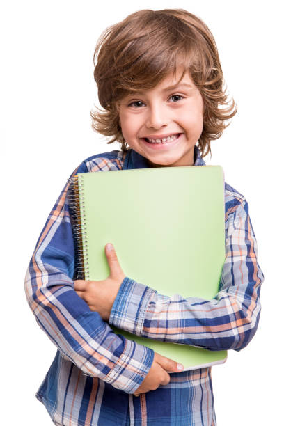 istock Boy holding school books 1254427402