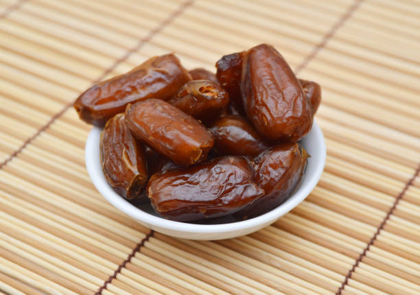 istock Dried dates (fruits of date palm Phoenix dactylifera). Infinite depth of field, retouched, clipping paths 1254427590