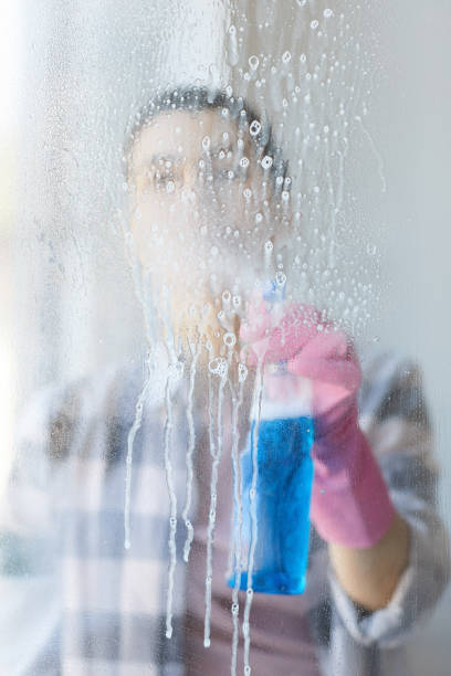 istock Cleaning the glass window 1254428384