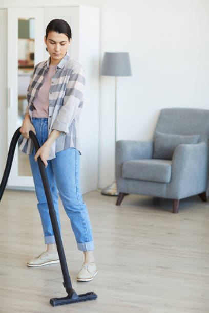 istock Maid cleaning the house 1254428728