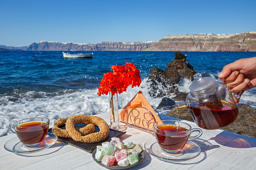 Picnic on the beach with tea and fresh pastries