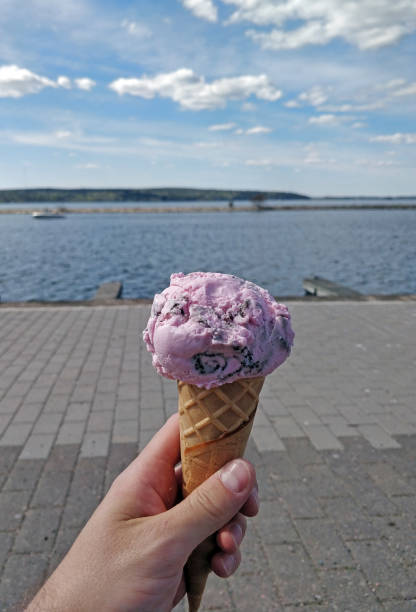 istock Pink ice cream cone with a beautiful background 1254434446