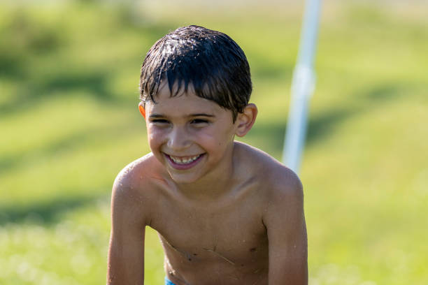 istock 6 year old hispanic boy enjoying summer 1254439419