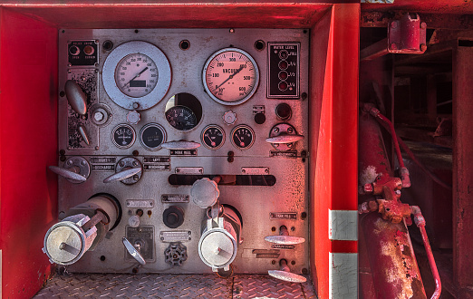Beautiful dashboard of a forgotten old fire truck, corroded by time.