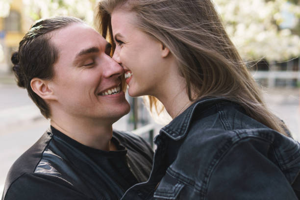 istock Young cheerful couple during a date outdoors 1254440848