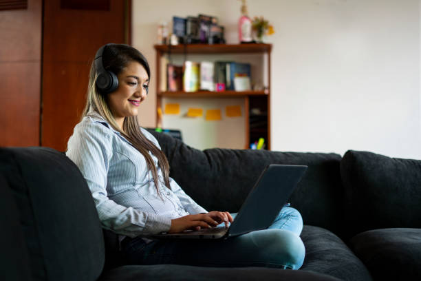 istock latin woman works from home 1254440918