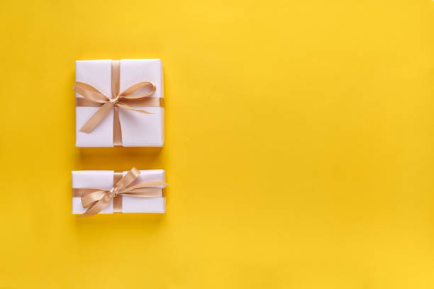 istock Gift box with ribbon and bow on color background and space for text. Top view 1254442847