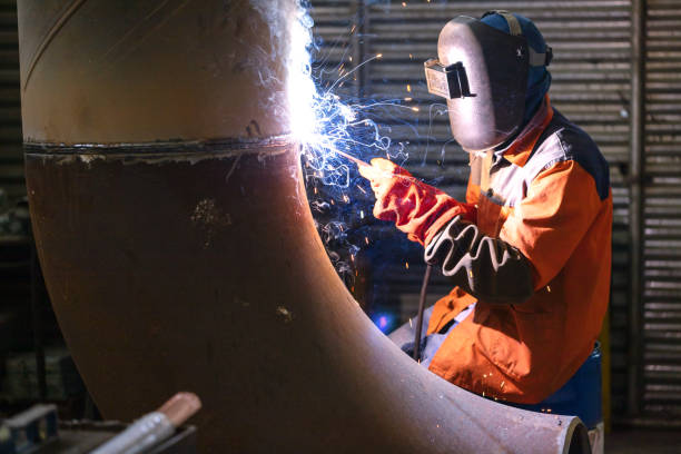 istock Welder working in a factory 1254443289