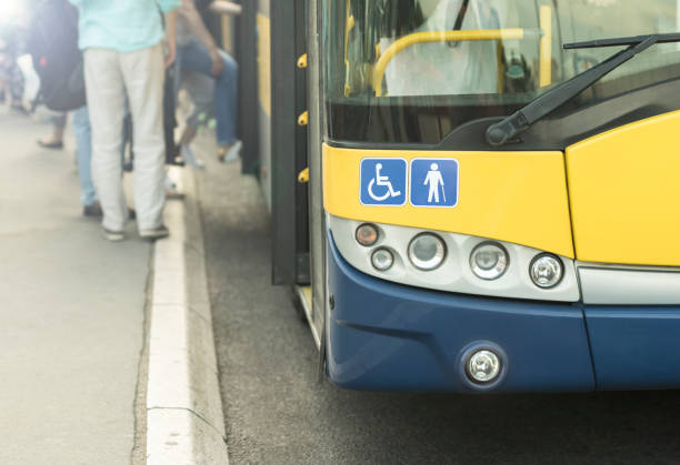 autobus urbano. segni con simboli di handicap. - disabled accessible boarding sign foto e immagini stock