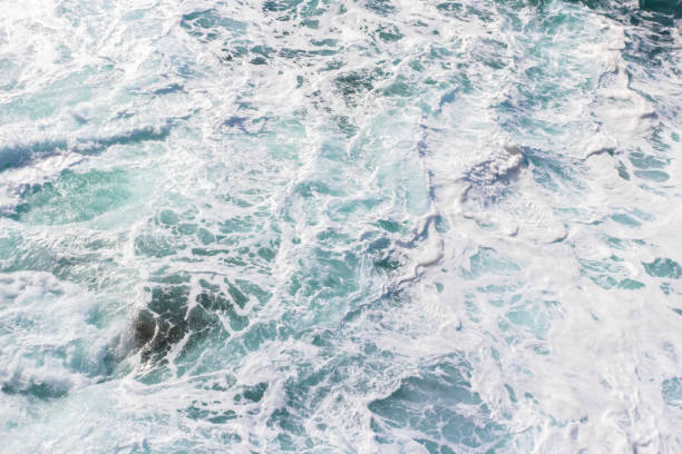 istock Foamy waves on the turquoise sea 1254445980