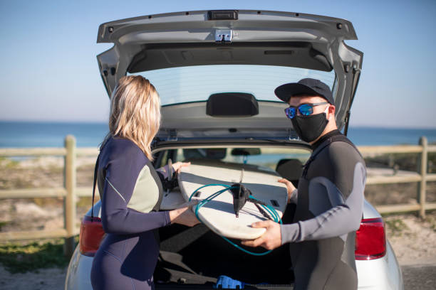 istock A young couple unloading their surf boards before going surfing in Cape Town, South Africa. 1254447862