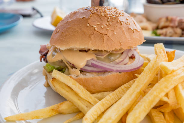 istock Big burger with french fries boundary 1254448083