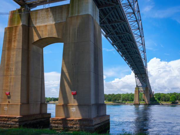 istock Tranquil landscape under the Bourne Bridge on Cape Cod Canal in Massachusetts, USA 1254449055