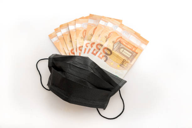 istock Covid-19 masks and money 1254450415