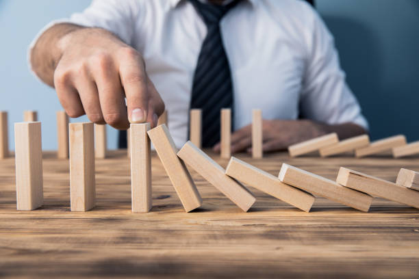 istock man hand wooden cubes 1254454446