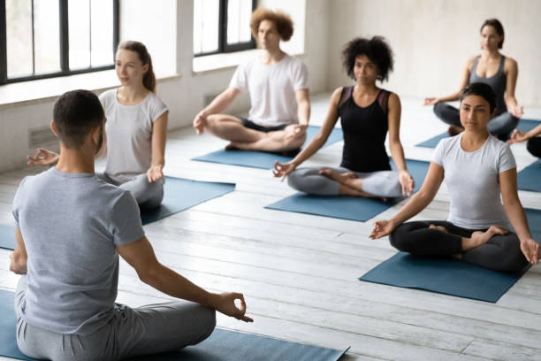 istock Young male instructor leading master class for multiracial people students. 1254455332